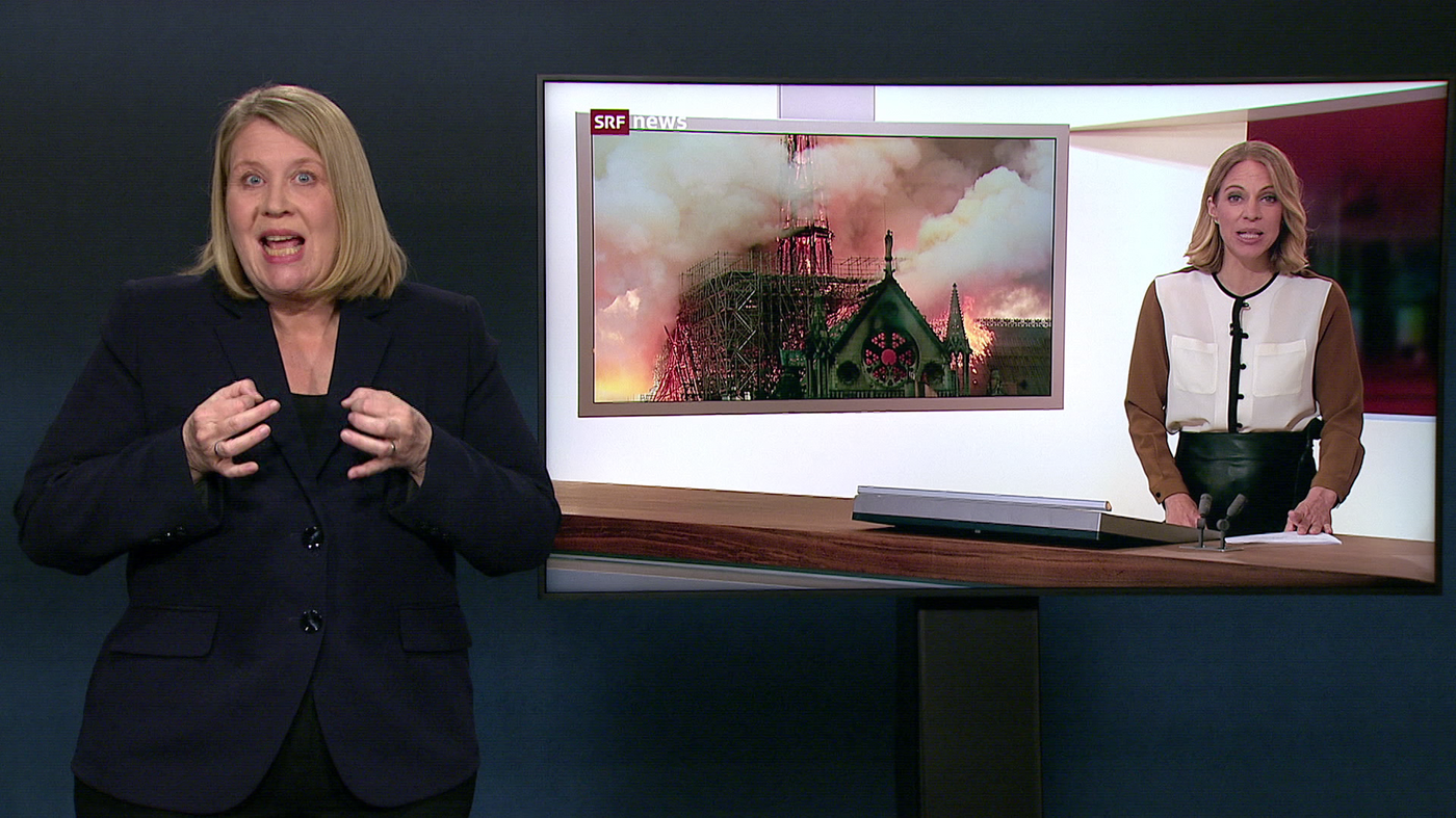 Tagesschauansprache zu Brand der Notre-Dame, daneben Simultanübersetzung in Gebärdensprache